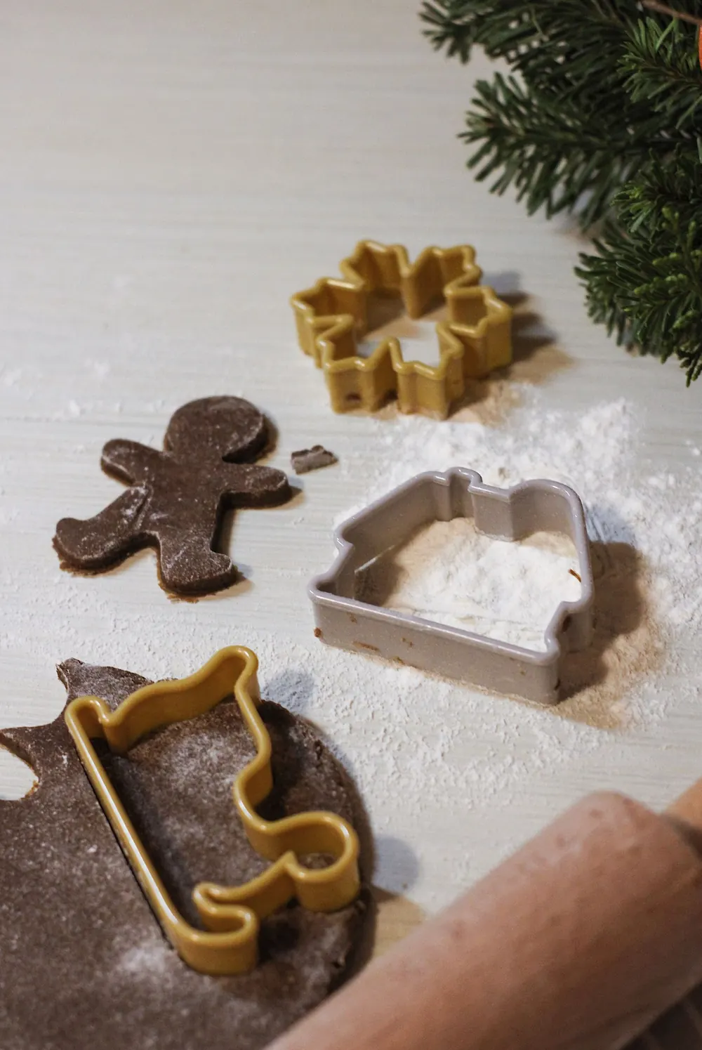 Gingerbread dough with festive cookie cutters ready for baking holiday treats.